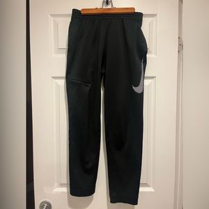 Boys size XL Nike dry-fit pants. Black with a white Nike swoosh on the left leg.